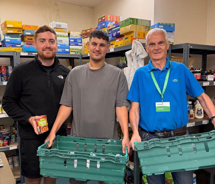 Three people in a foodbank