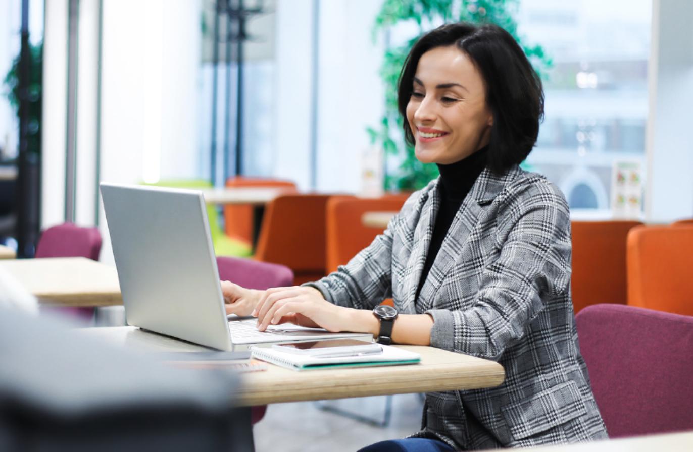 A woman at a desk on a laptop