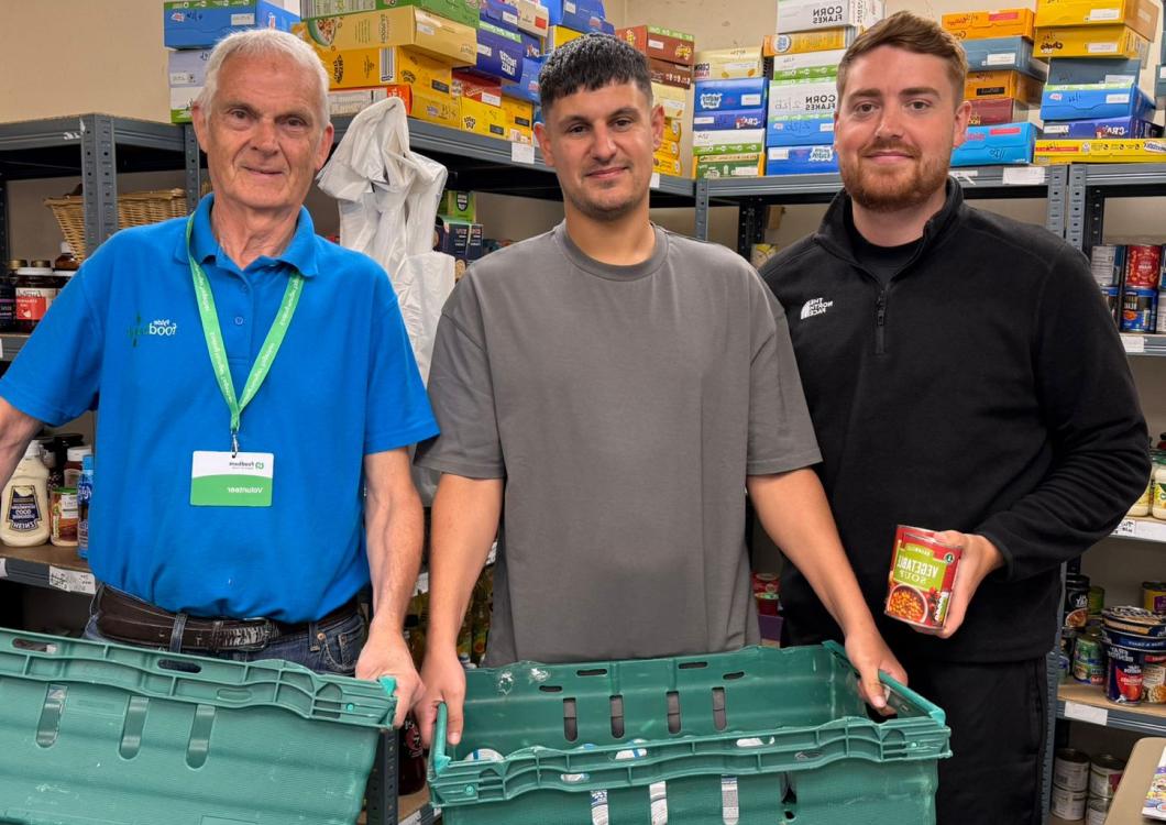 Three people in a foodbank