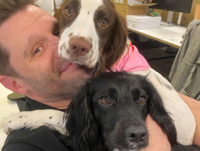 A man with two dogs